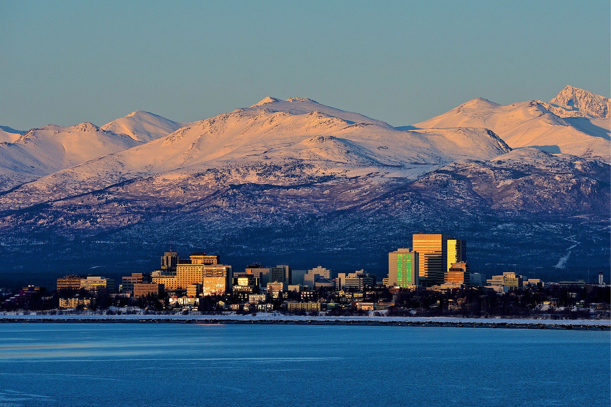 City skyline in distance with mountains behind